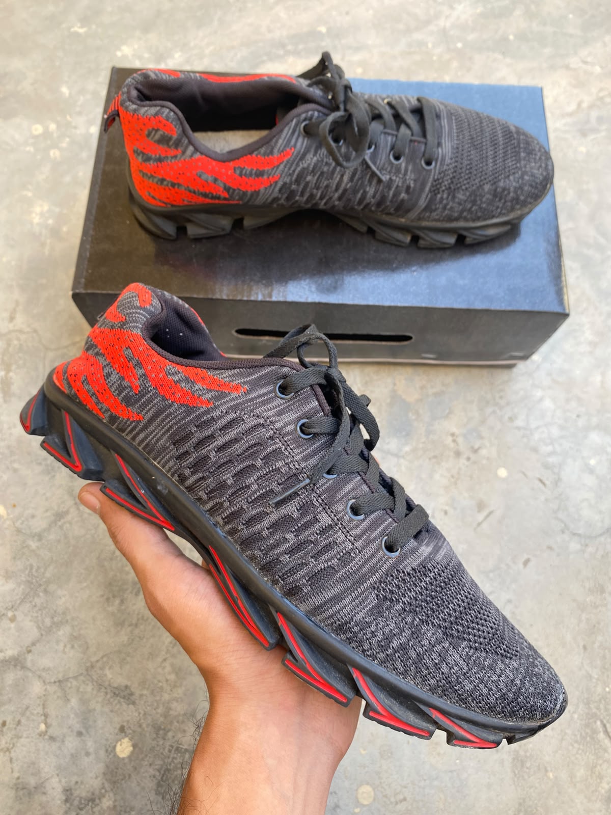 Black and red mesh athletic running sneakers
