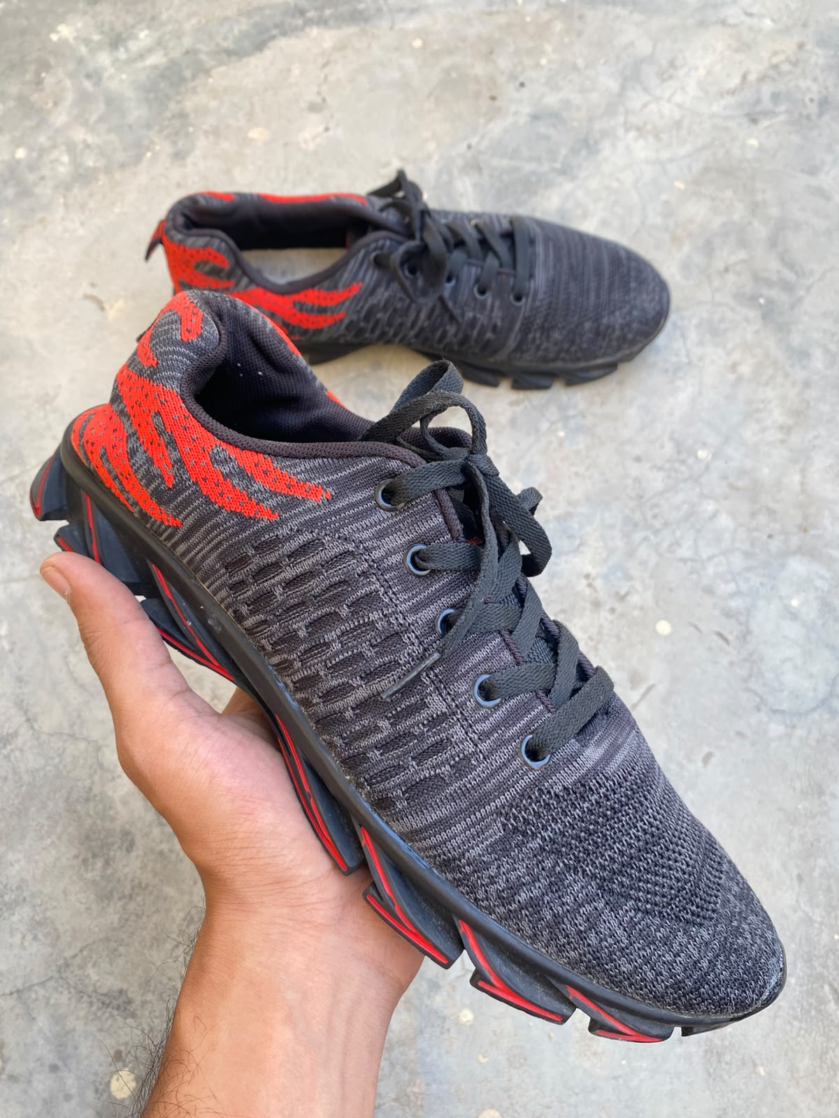 Black and red mesh athletic running sneakers