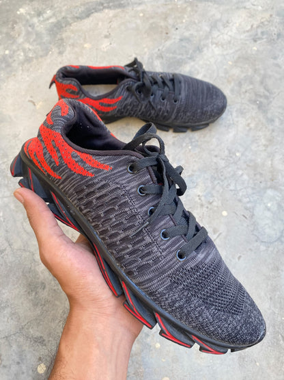 Black and red mesh athletic running sneakers