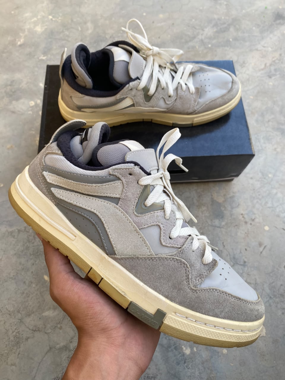 Grey and white low-top casual sneakers