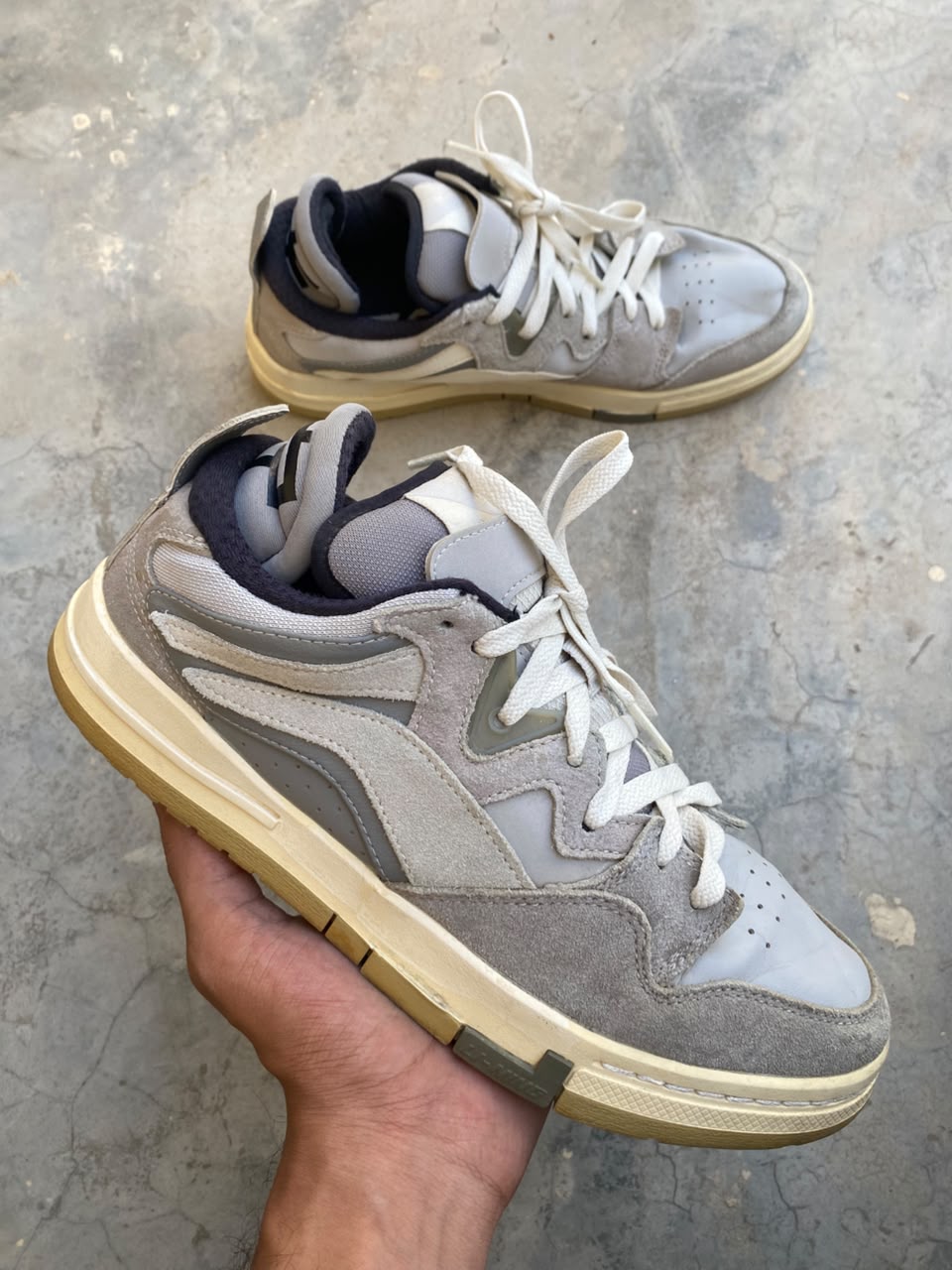 Grey and white low-top casual sneakers