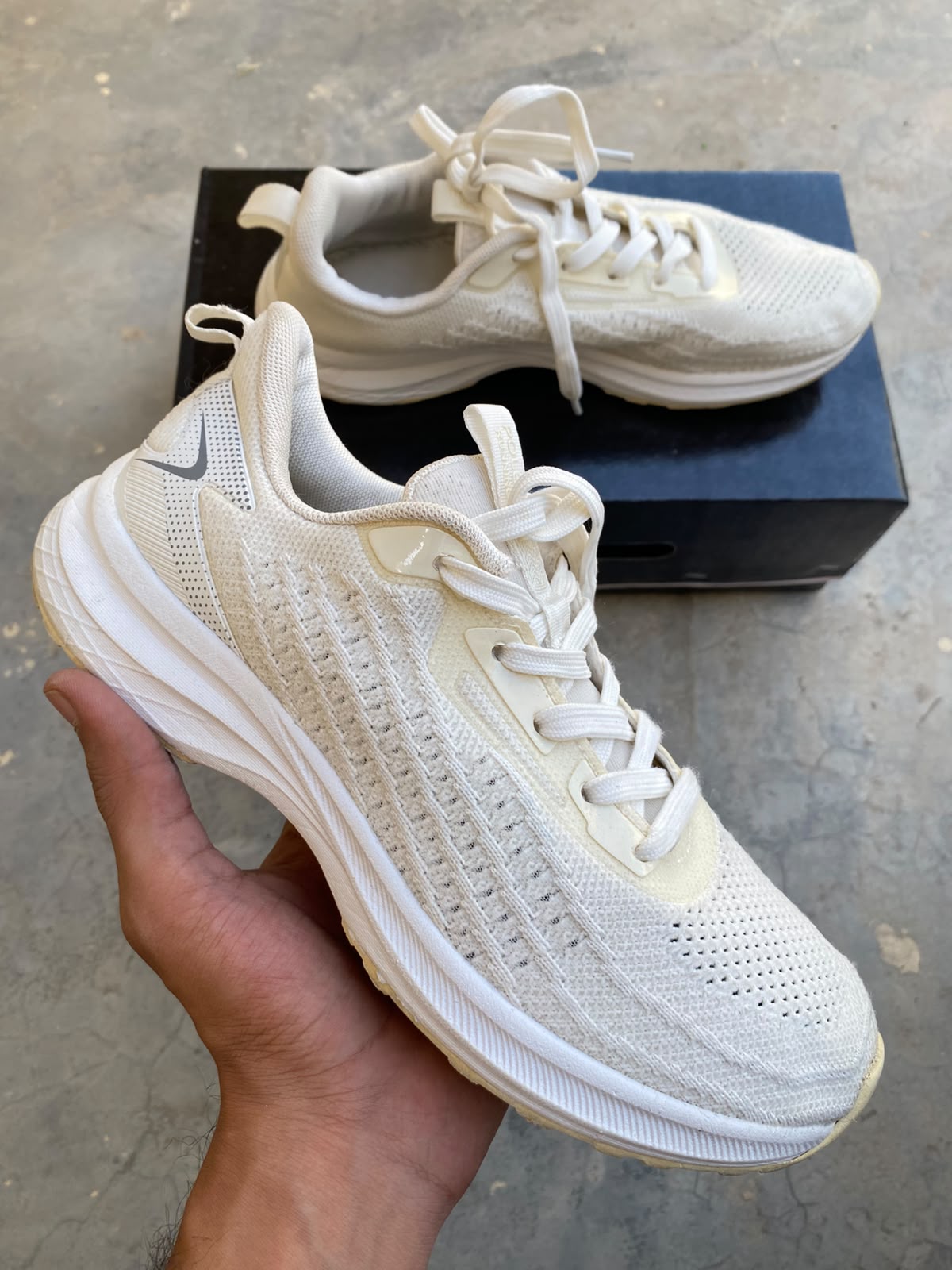 Off-white low-top knit athletic running shoes